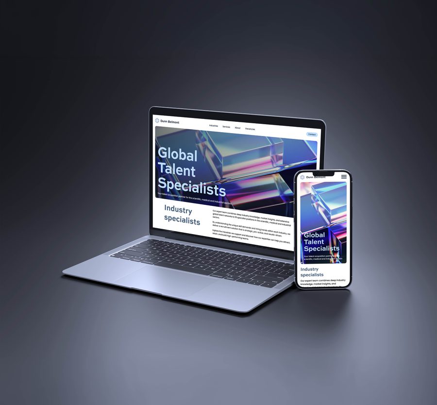 Laptop and smartphone displaying a responsive website for Dunn Belmont, featuring "Global Talent Specialists" headline with colourful geometric imagery and industry information.
