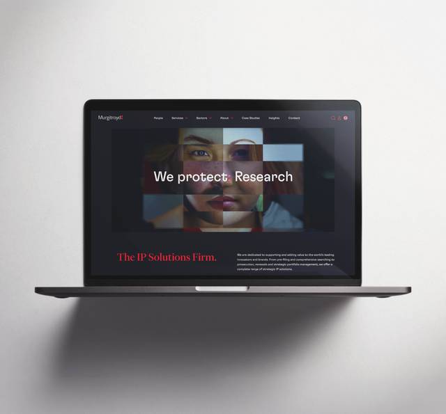 Laptop displaying Murgatroyd's website with headline "We protect: Research" and tagline "The IP Solutions Firm" overlaid on a fragmented portrait image.
