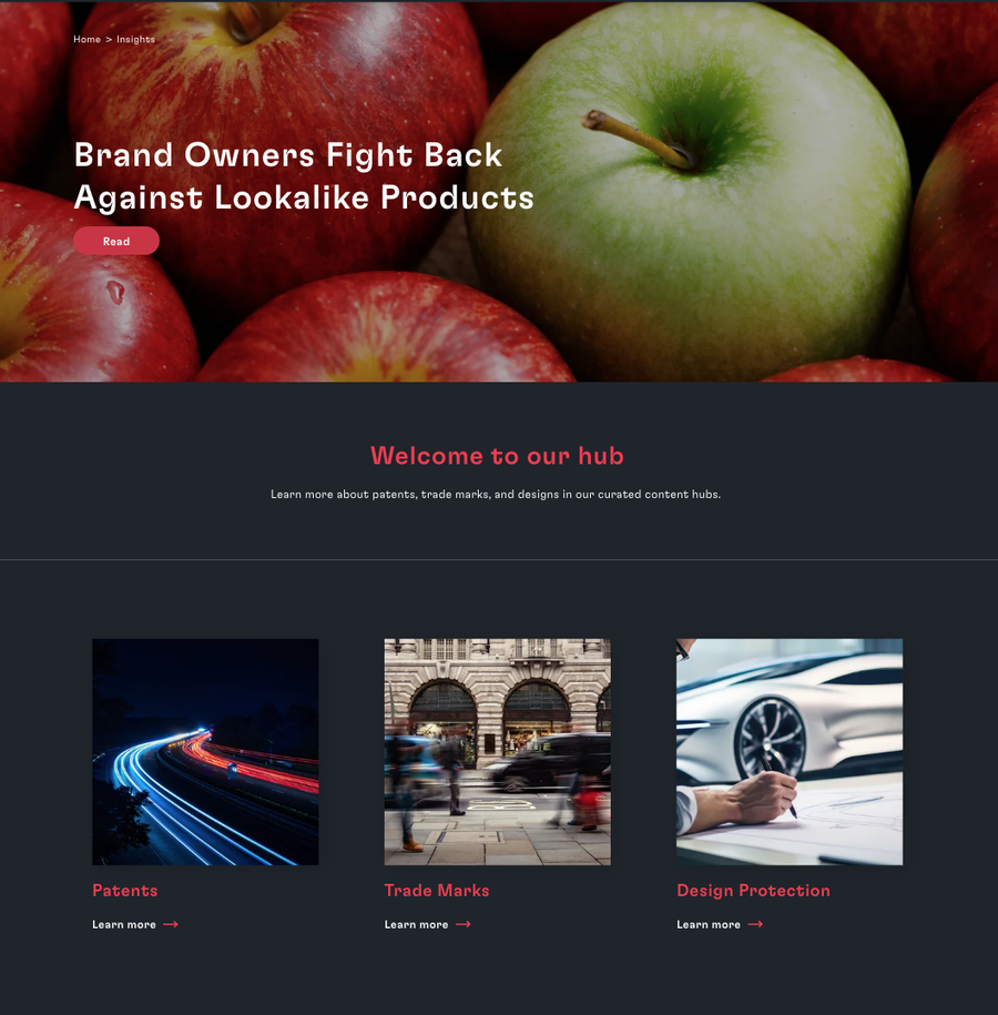 Close-up of a cluster of red and green apples, with focus on a single green apple in the centre on a dark background.