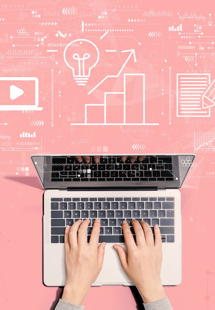 Hands typing on a laptop with digital icons and graphs floating above, representing data analysis and digital communication.