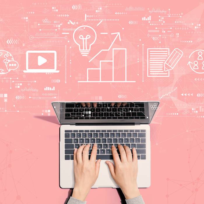Hands typing on a laptop with digital icons and graphs floating above, representing data analysis and digital communication.