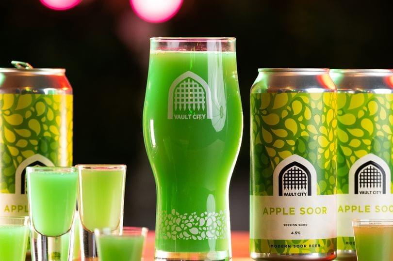 Bright green beer in a pint glass