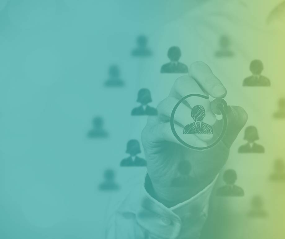A hand drawing a person icon inside a circle, with background of blurred human profile icons connected by lines, symbolising networking or recruitment.