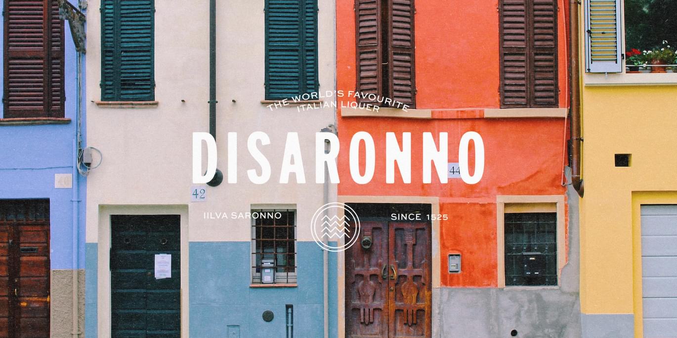 An image of a colourful Italian building with the new Disaronno font overlaid on it.