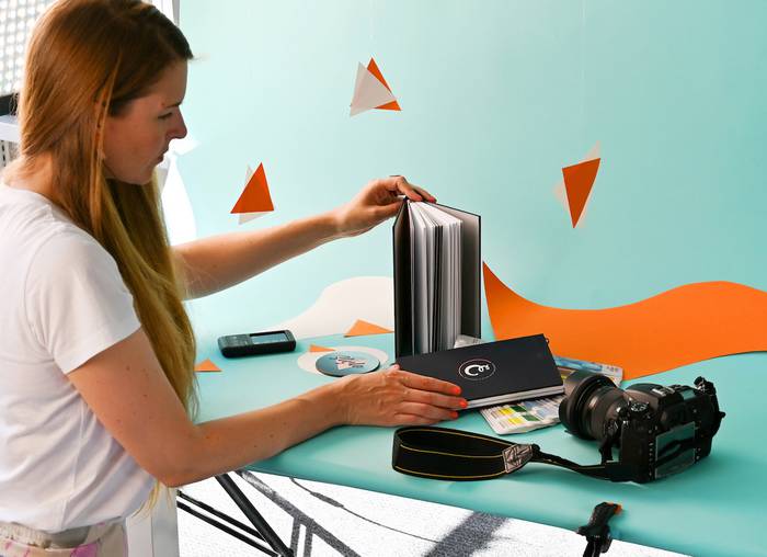 Our Motion and Digital Designer, Mel, arranging a photography shoot.