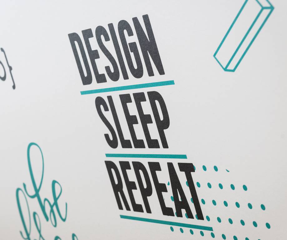 The image features the words "Design", "Sleep", and "Repeat" in bold black text with teal lines beneath each word, surrounded by minimalistic doodles on a white background.