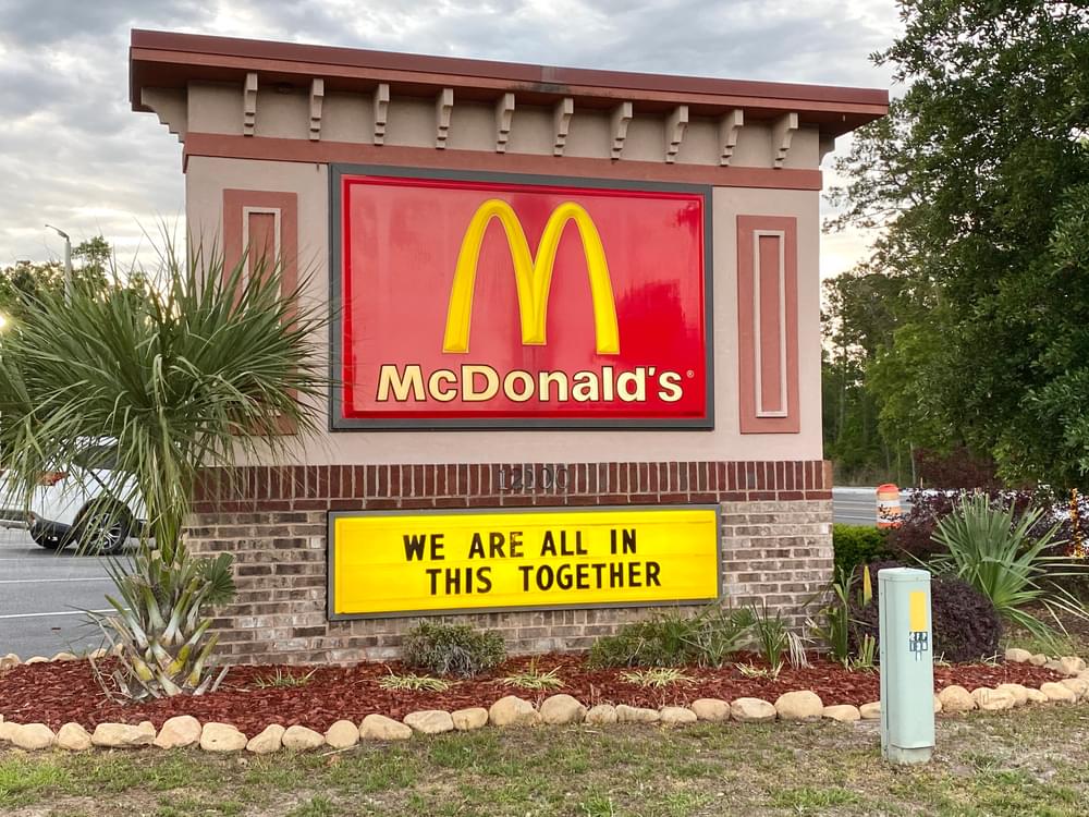 McDonald’s store road sign reads ‘we are all in this together’ to encourage people during the COVID-19 pandemic.