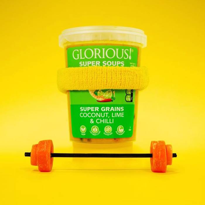 Glorious! soup pot dressed as a weight lifter with a yellow sweat band and carrot weights
