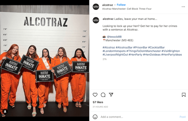 A screenshot of Alcotraz's Instagram of people dressed up as prisoners in a line up wearing orange jumpsuits
