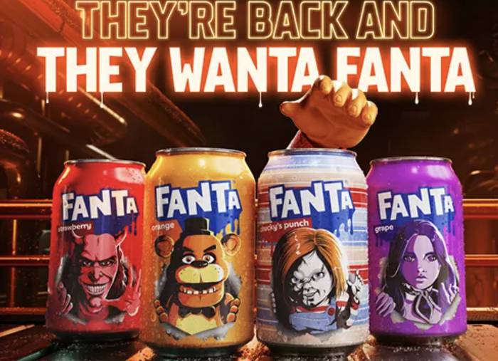 Four Fanta cans with different characters and colours are arranged in a row, with a hand reaching over the third can, in a vibrant, animated style.