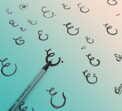 Black scribbles drawn with a pen on a white paper, with some words partially visible, placed on a light, smooth surface.