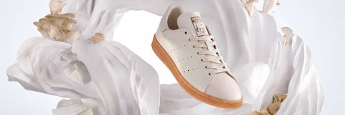 an image of cream coloured trainers made from mushroom leather