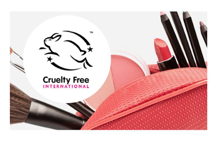 A make up bag holding makeup brushes with the cruelty free hopping bunny logo
