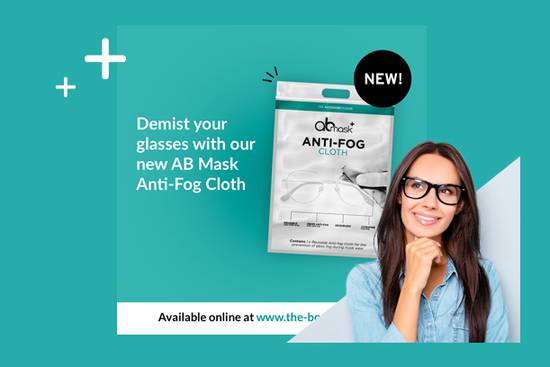 Smiling woman with glasses in the lower right corner, next to a package of anti-fog cloths for glasses on a teal background.
