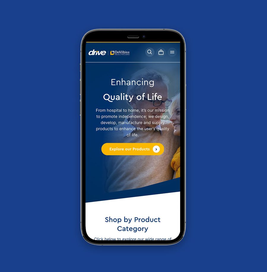 Smartphone displaying a healthcare website with a blue background, featuring a woman and elderly man, and a yellow "Explore our Products" button.