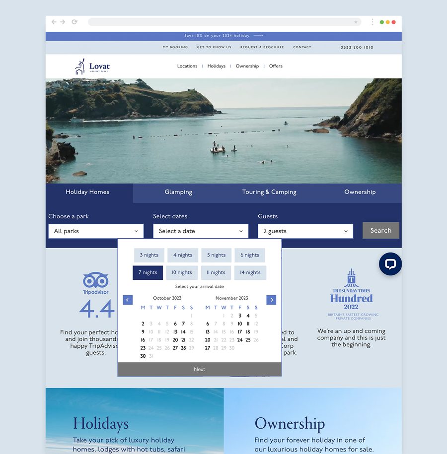 A travel website homepage showing a scenic harbour view, search options for parks and dates, a TripAdvisor rating, and promotional banners.