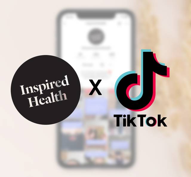 A blurred smartphone screen with TikTok logo and Inspired Health logo overlapping, highlighting a collaboration or partnership.