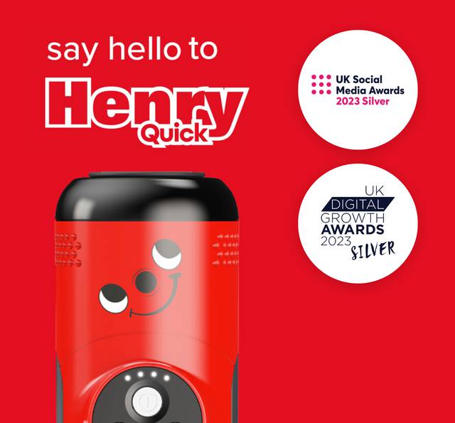 A red device with a smiling cartoon face, surrounded by two award logos, set against a red background with text promoting UK social media awards.
