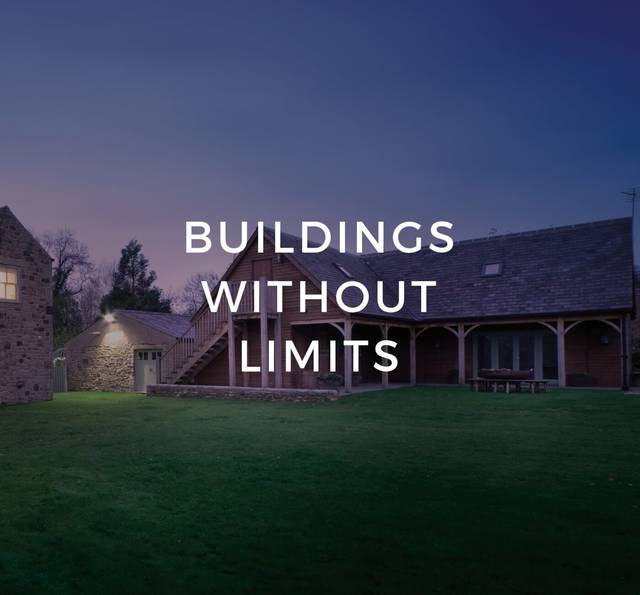 A stone and wooden house with outdoor stairs, surrounded by a lawn at dusk, overlaid with the text "BUILDINGS WITHOUT LIMITS".