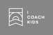 A simplified black and white logo featuring a shield with stylised mountains and waves, alongside the words "Coach Kids" in bold capital letters.
