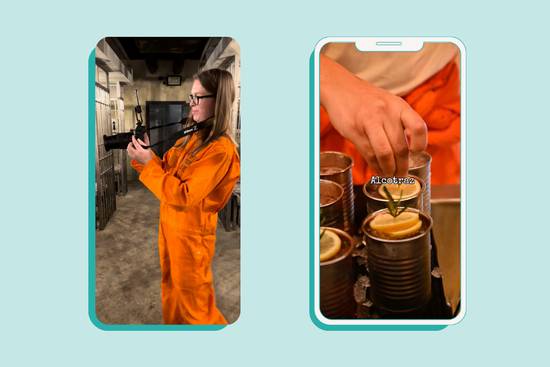 A woman in an orange jumpsuit holding a camera, and a hand garnishing drinks in cans with lemon slices and herbs on a smartphone screen.